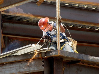 man welding on a construction site
