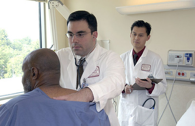 doctor checking a patient
