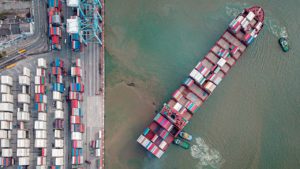 boat from above with shipping containers