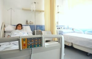 sick person in hospital bed 