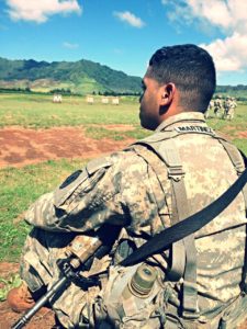 soldier sitting in a field