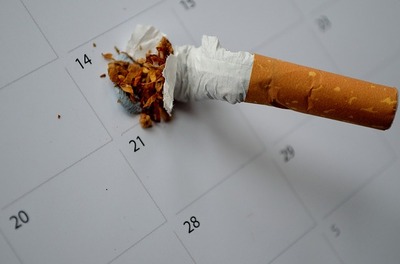 cigarette crushed on a calendar 